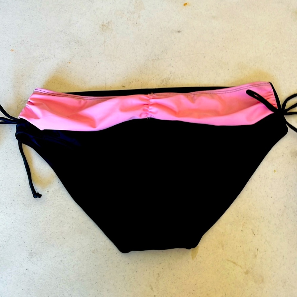 Large, new pink and black bathing suit bottoms. Never worn